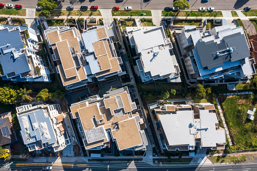 Aerial view of Suburban high rise Apartment roof tops directly above