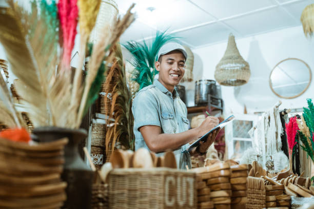 istock smiling man holds the clipboard while list items among craft items 1327204272