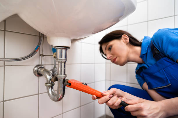istock Plumber Fixing A Sink In Bathroom 1327204428