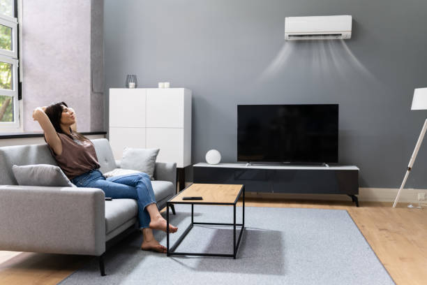 istock Woman Relaxing Under The Air Conditioner 1327204451