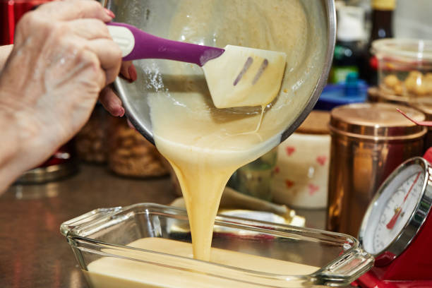 istock The chef pours the finished dough into mold for making cherry pie, clafoutis. Step by step recipe 1327205114