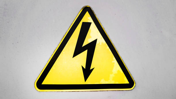 istock Lightning danger sign hanging on concrete gray building wall 1327210081