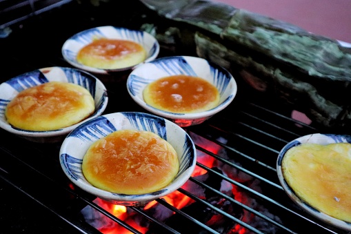 This is one of the most popular street food in Cambodia. It's called Pong Mean Dot or Burning Eggs