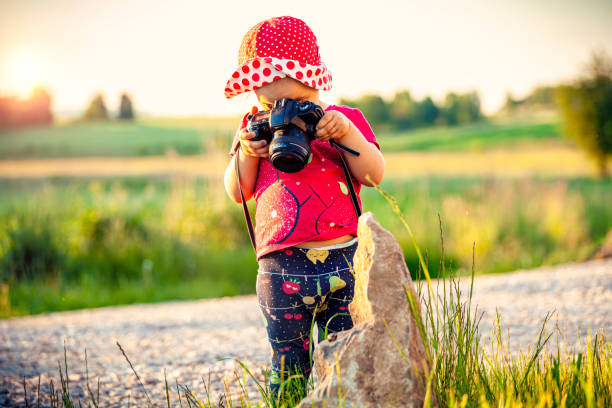 istock Little girl with the camera 1327214227