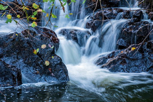 Fresh water flowing through rocks in an English Lake District river.