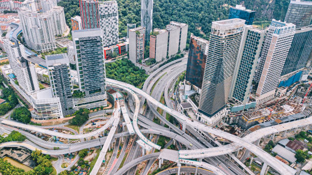 istock Drone view directly above city under construction with incomplete elevated road bridges cross junction 1327215747