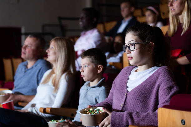 istock Viewers express negative emotions while watching horror movie in cinema 1327216789
