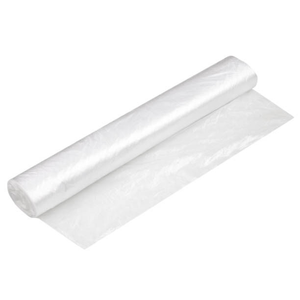 istock Polypropylene or polyethylene rolls for packaging in food bags.Transparent blank Cellophane bags in a roll isolated on a white background. Wrapping plastic film, plastic oven cooking bags. 1327216967