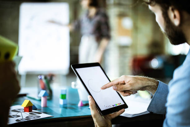 istock Close up of a design professional drawing on a touchpad. 1327218376