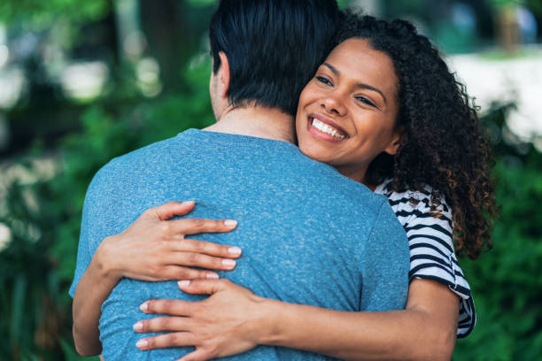 istock Couple hugging outdoors 1327222600