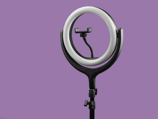 istock ring lamp with the smartphone holder on lilaceous background 1327228809