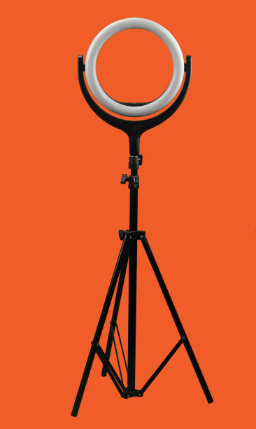 ring lamp on a tripod on bright red background