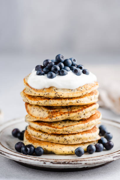 istock Poppy Seed Pancakes Served With Greek Yogurt And Blueberries 1327229342