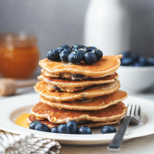 istock Stack of pancakes with blueberries and syrup 1327230070