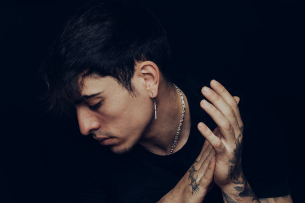 istock Young man with tattoos clapping the hands 1327230380