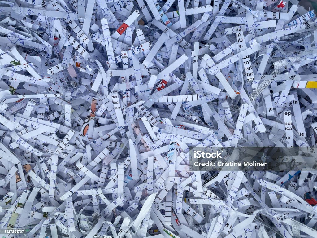 Heap of shredded papers to recycle in an office Picture of heap of shredded papers to recycle in an office Shredded Stock Photo