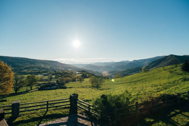 istock Mountainous landscape with grassy meadows under blue sky 1327233983