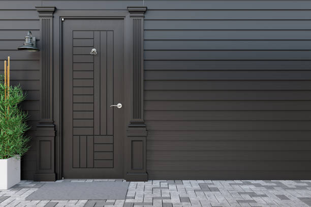 istock Black Front Door with Empty Wooden Wall 1327234147