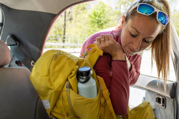 istock Female unloading climbing equipment from a car 1327235029
