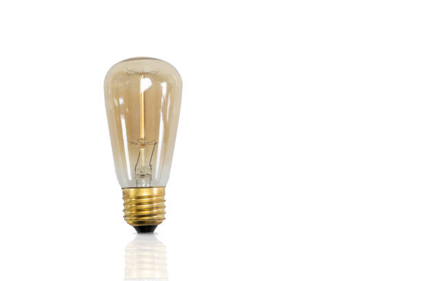istock Vintage light bulb isolated on white. 1327235692