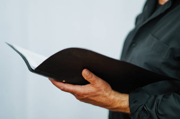 istock Hand of a singer or speaker holds notes or text 1327235749