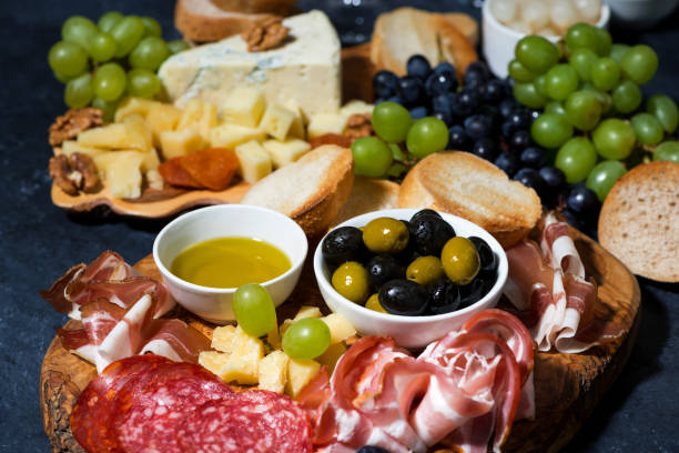 istock cold cuts, bread and cheese on wooden board 1327235789