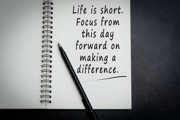 istock Motivational and inspirational quote on notebook with dark background 1327238443