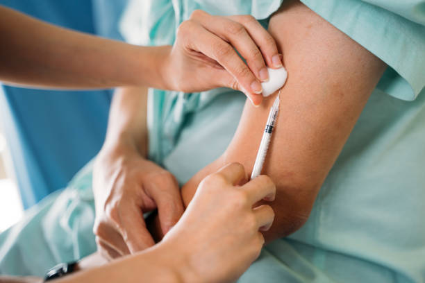 istock Doctor hands giving vaccination to patient 1327239161