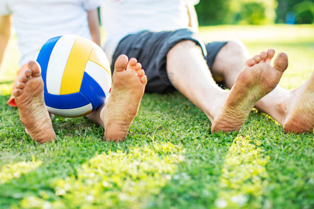 Father and son resting after football