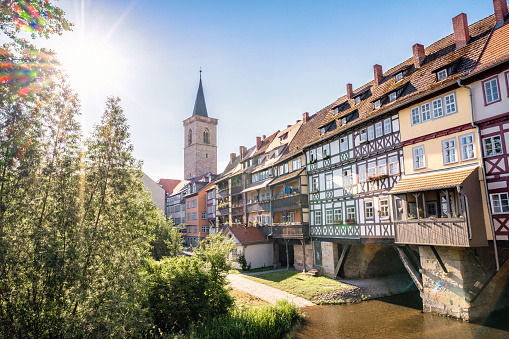 view on the facades of the historic Kraemerbrücke in Erfurt old town under sunny summer sky
