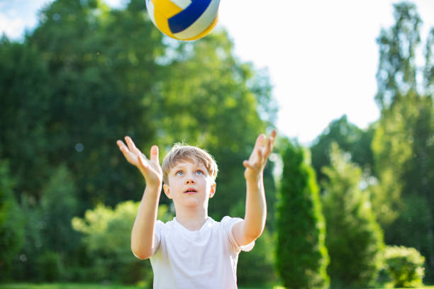 istock Little boy playing with soccer ball 1327240743