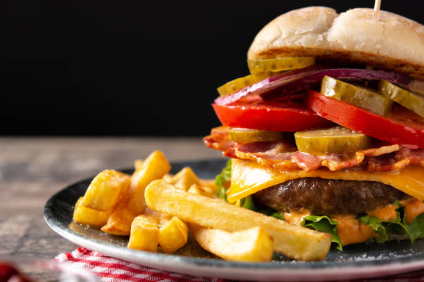 istock Beef burger with cheese, bacon and french fries 1327242886