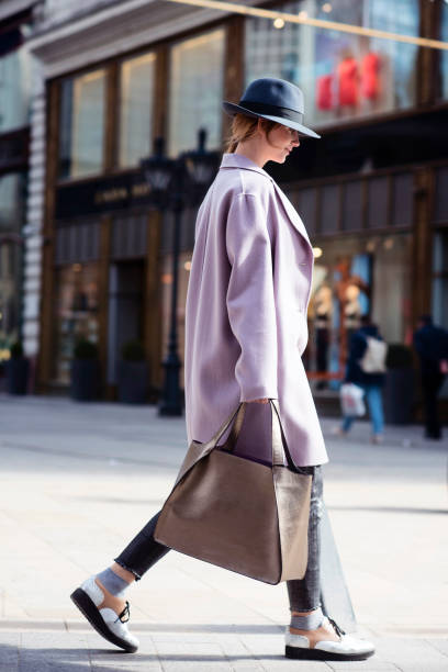 istock young woman walks down the street 1327243225