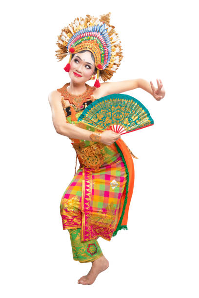 Asian woman dancing Balinese traditional dance isolated over white background