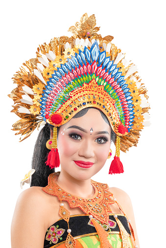 Asian woman dancing Balinese traditional dance isolated over white background