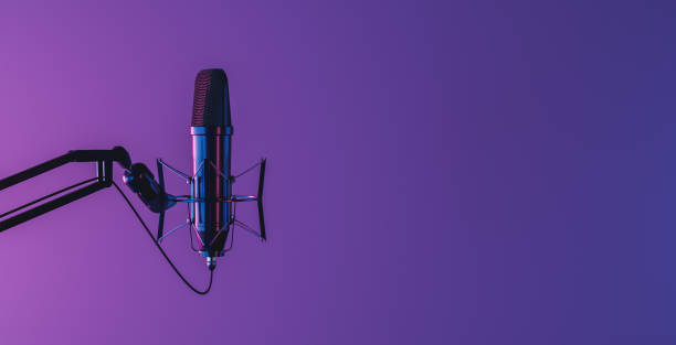 microphone with neon light studio microphone isolated on dark background with neon lighting and space for text. 3d render radio stock pictures, royalty-free photos & images