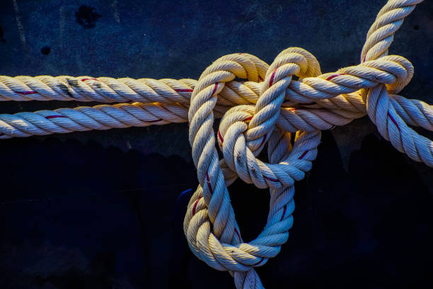 istock Ship rope knot in water. 1327244728
