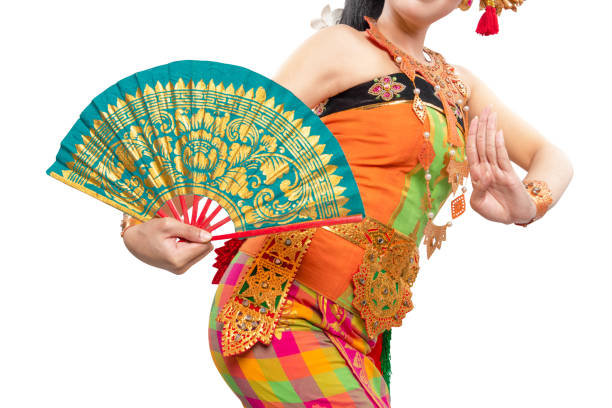 Woman dancing Balinese traditional dance isolated over white background