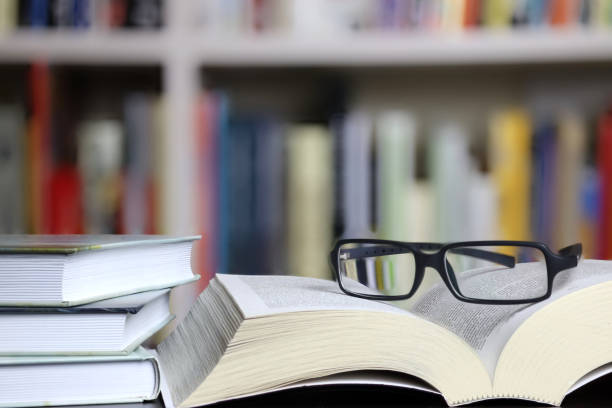 istock books on blurred bookshelf background, 1327245248