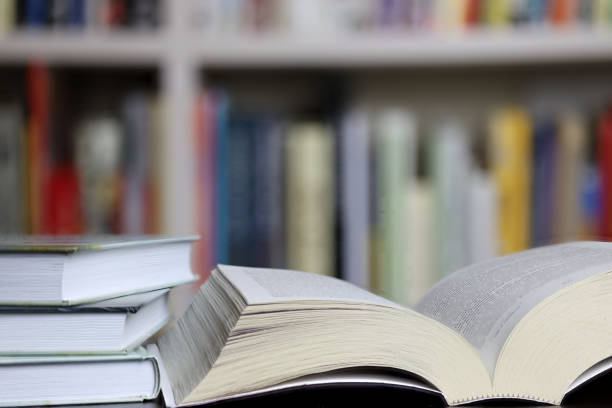 istock books on blurred bookshelf background, 1327245273