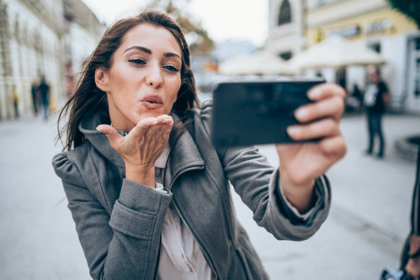 istock Young woman making selfie outdoors. 1327248626