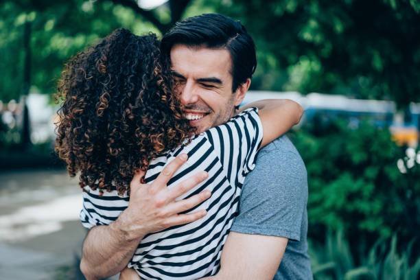 istock Happy couple hugging outdoors. 1327248641