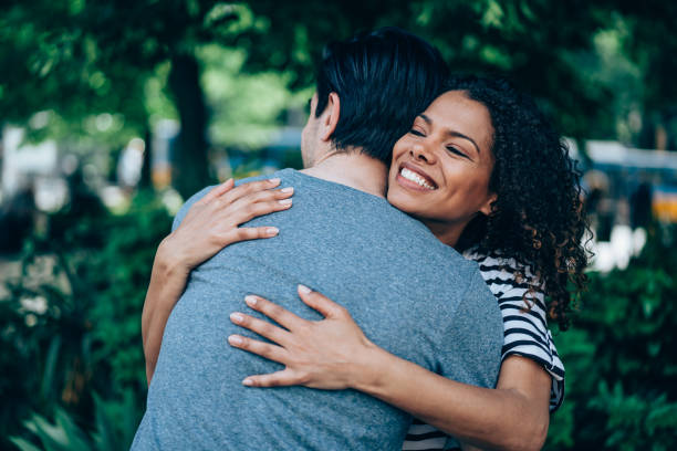istock Happy couple hugging outdoors. 1327248818