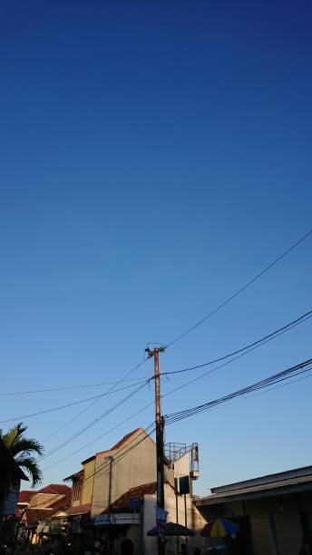 istock Photo of a power pole and blue sky 1327249786