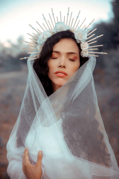 istock Young woman with vail in nature 1327250041