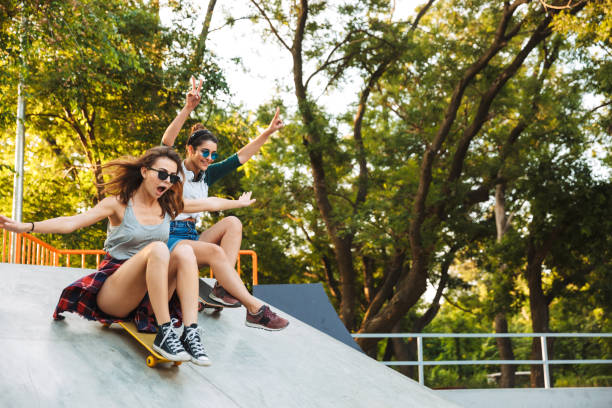 istock Two excited young girls having fun while riding 1327250202
