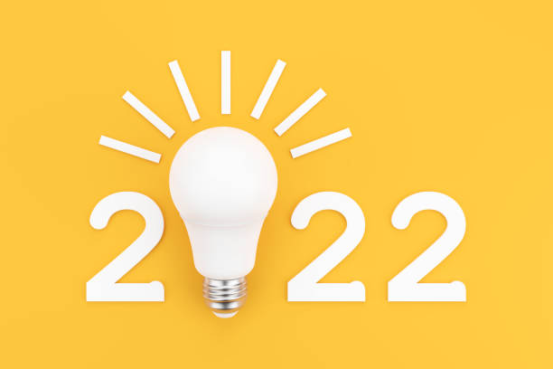 istock 2022 with a white LED lamp on a yellow background. 1327250739