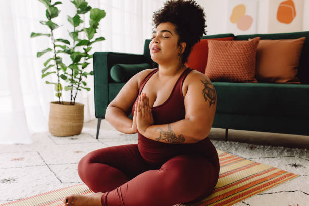 istock Healthy woman practicing relaxation yoga at home 1327250876