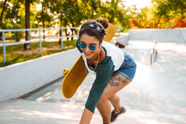 istock Cheerful young girl in eaephones 1327253904