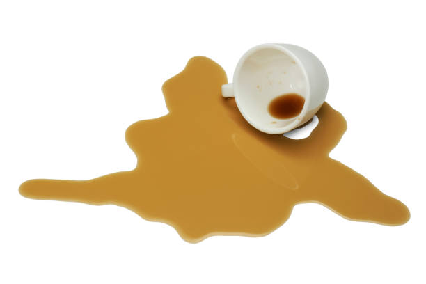 istock Overturned cup and spilled coffee on white background 1327256854